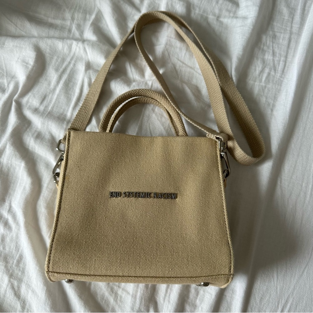 End systemic racism bag by Brandon Blackwood